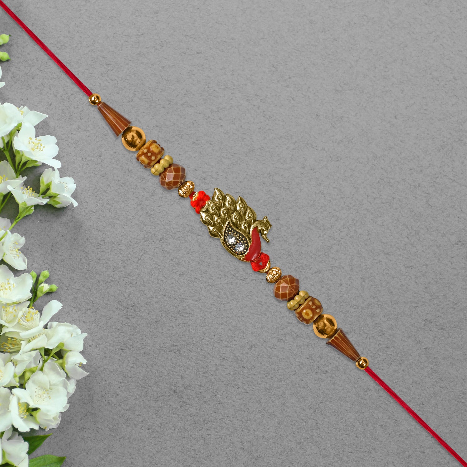 Antique Peacock Feather Rakhi With Beaded Thread Antique Peacock Feather Rakhi With Beaded Thread